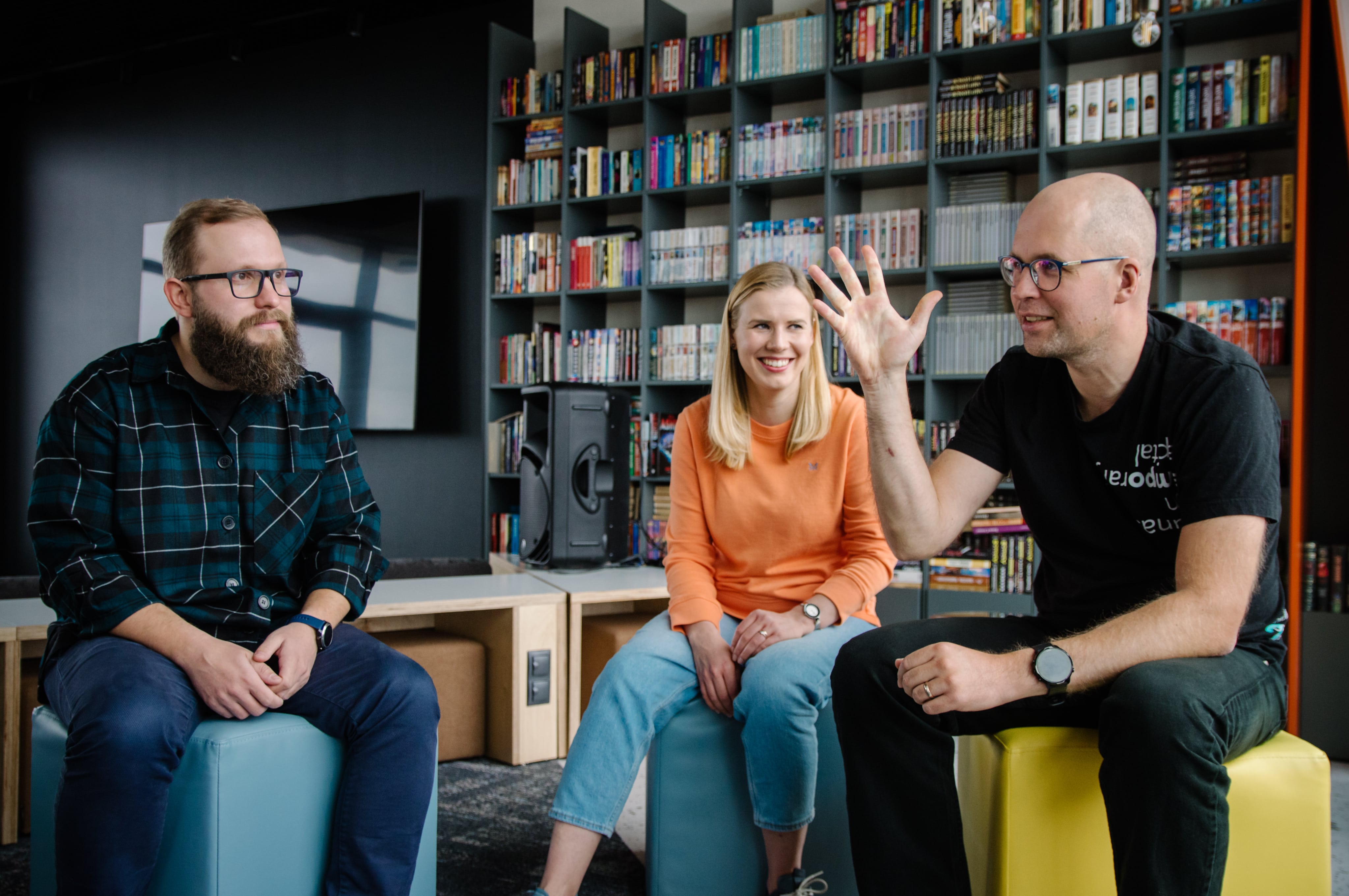 Collaborating in our office LupaSearch teammates having an informal discussion in the office lounge