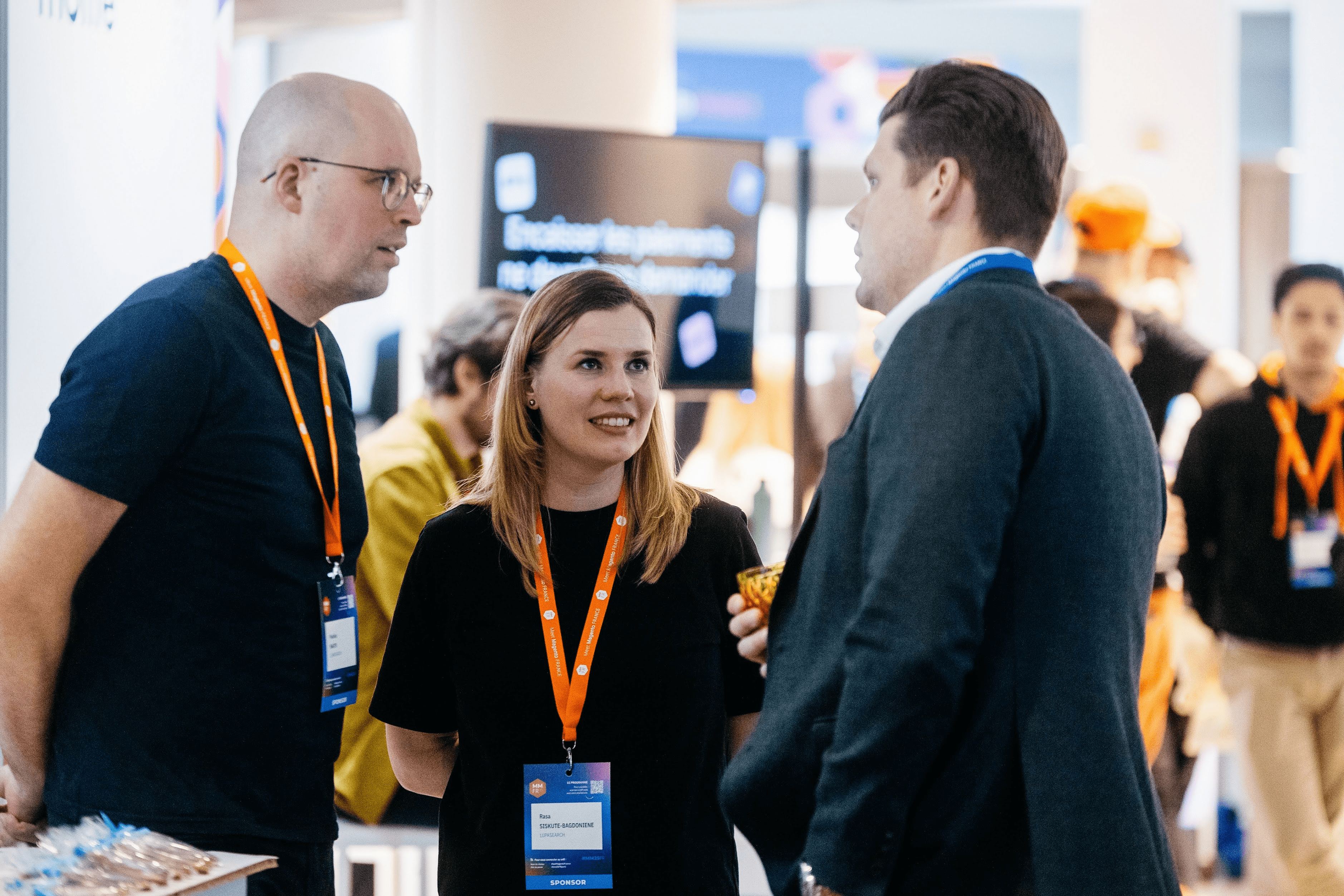 Talking search with ecommerce leaders LupaSearch team members networking with visitors at an industry event